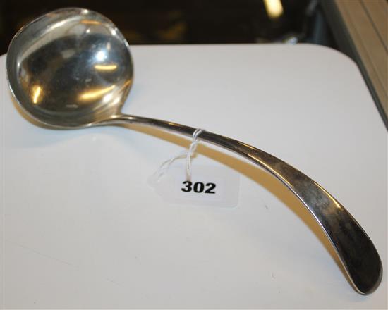 A silver soup ladle